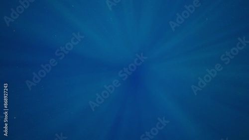 Sun light deep blue underwater background