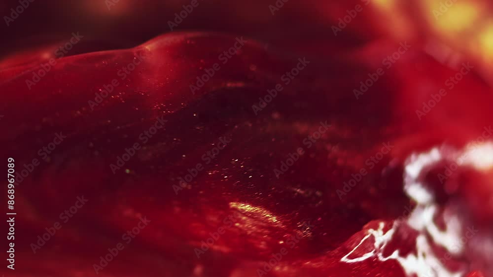 Honey liquid. Amber stone. Defocused golden color sparkling mineral shimmer particles luxury shiny substance glow light abstract art background. Honey liquid. Amber stone. Defocused golden color sparkling mineral shimmer particles luxury shiny substance glow light abstract art background.