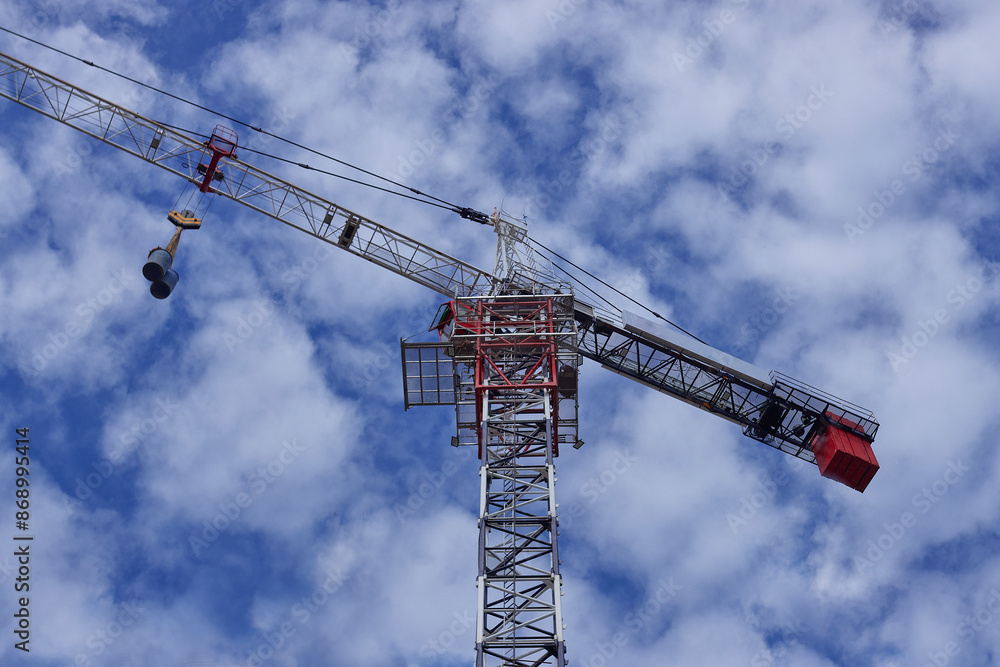 a working crane for the construction of a high-rise building, concrete structures a working crane for the construction of a high-rise building, concrete structures