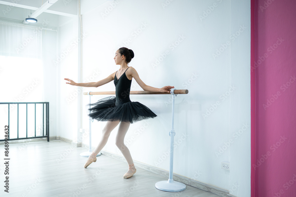 A girl ballet student practices ballet dancing at home with a white background A girl ballet student practices ballet dancing at home with a white background