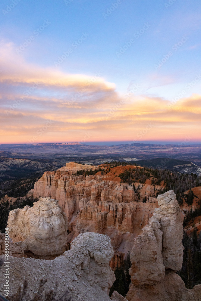 Experience the breathtaking beauty of Bryce Canyon National Park in Utah with its unique rock formations and expansive landscape, all illuminated by the captivating colors of a sunset Experience the breathtaking beauty of Bryce Canyon National Park in Utah with its unique rock formations and expansive landscape, all illuminated by the captivating colors of a sunset