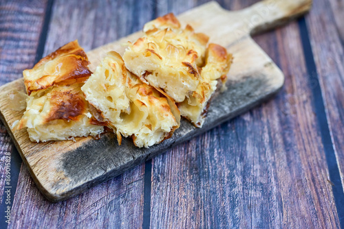 Bakery .Home made  cheese pie  with phyllo pastry and organic eggs. Bulgarian banitsa photo