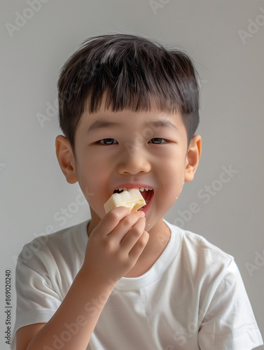 child eating food on white background