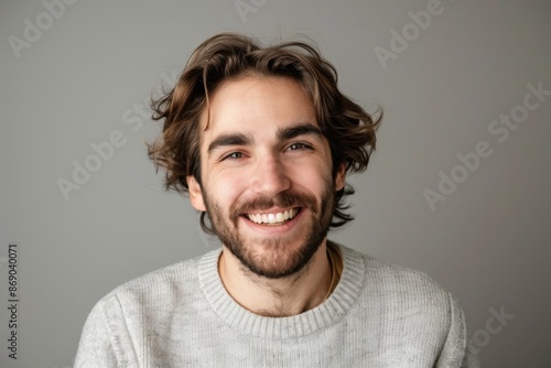 Portrait of attractive glad cheerful man over neutral background