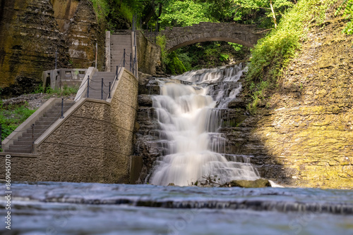 Photo of a waterfall with a trail / concrete stairs located in Ithaca, NY, USA. photo