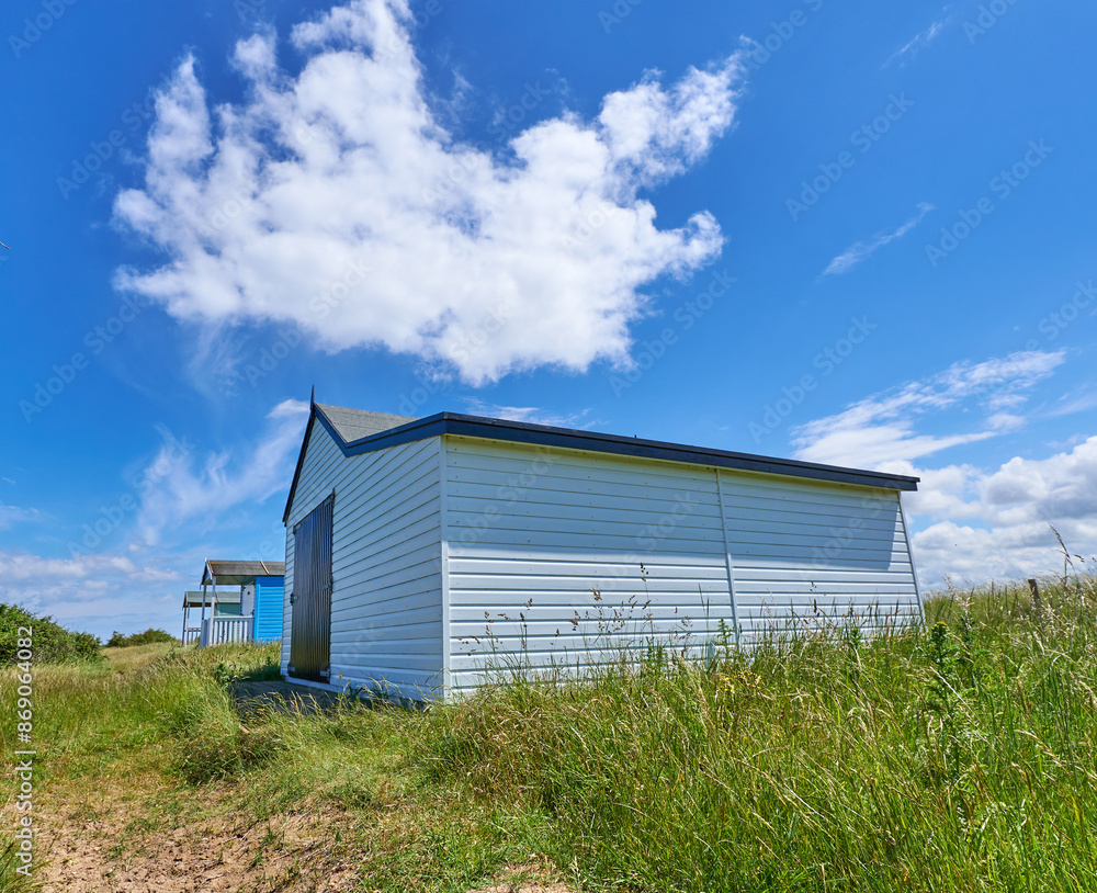 Pastel color wooden beach hut at Old Hunstanton, Norfolk, UK Pastel color wooden beach hut at Old Hunstanton, Norfolk, UK