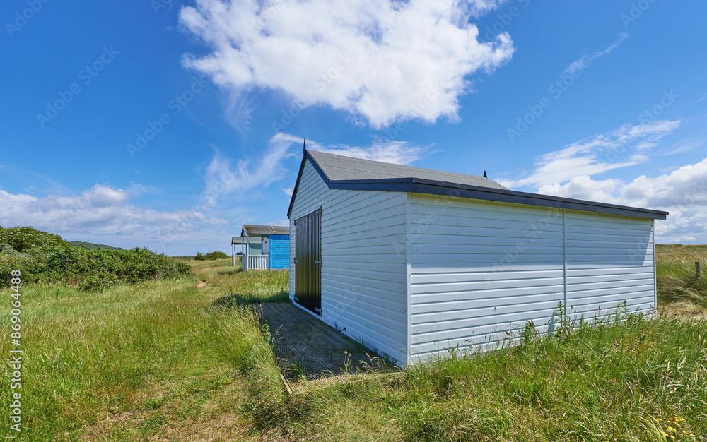 Pastel color wooden beach hut at Old Hunstanton, Norfolk, UK Pastel color wooden beach hut at Old Hunstanton, Norfolk, UK