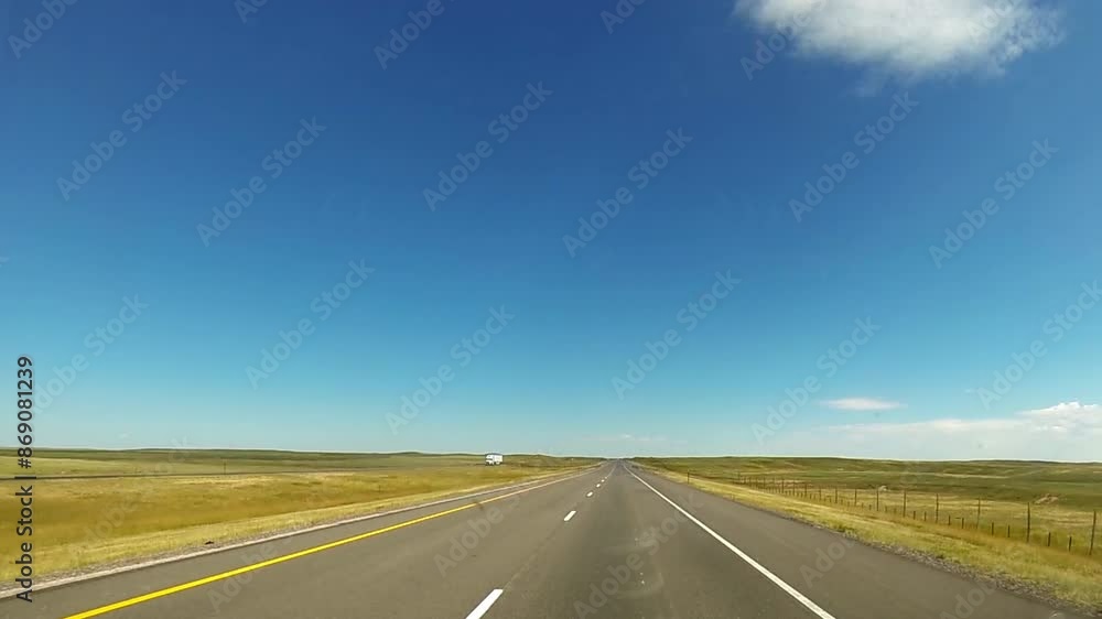 Driving point-of-view traveling on empty Wyoming highway. Driving point-of-view traveling on empty Wyoming highway.