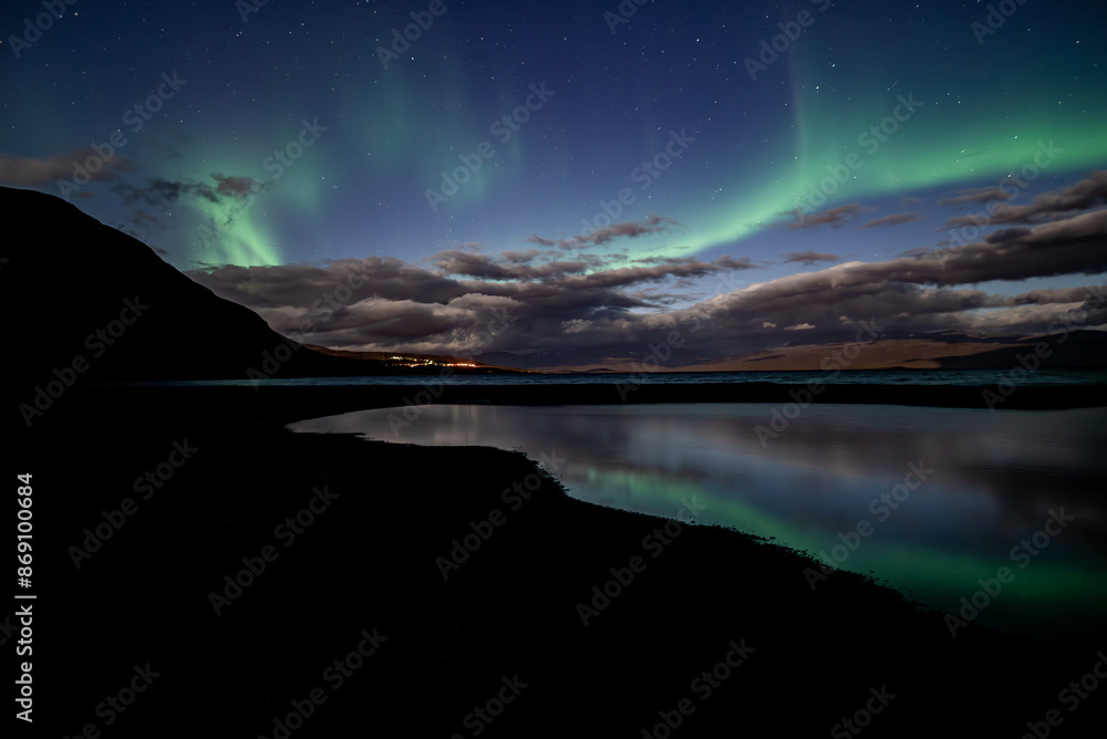 Monnlight lake with dancing of northern light in Abisko national park in north of Sweden Monnlight lake with dancing of northern light in Abisko national park in north of Sweden