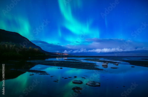 Monnlight lake with dancing of northern light in Abisko national park in north of Sweden photo