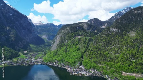 Breathtaking Aerial View of Hallstatt Village, Austria. Flying Over UNESCO World Heritage Site in Austria with Austrian Alps and a Lake, Romantic Village of Hallstatt in Europe. photo