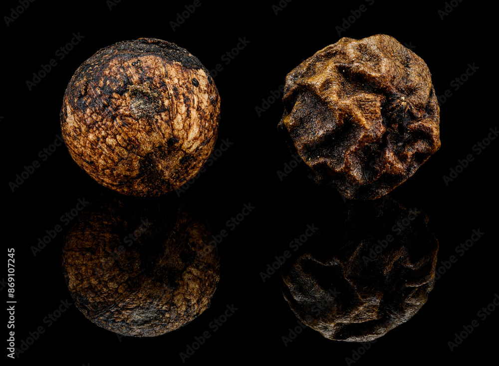 black pepper corns in detail with reflection black pepper corns in detail with reflection