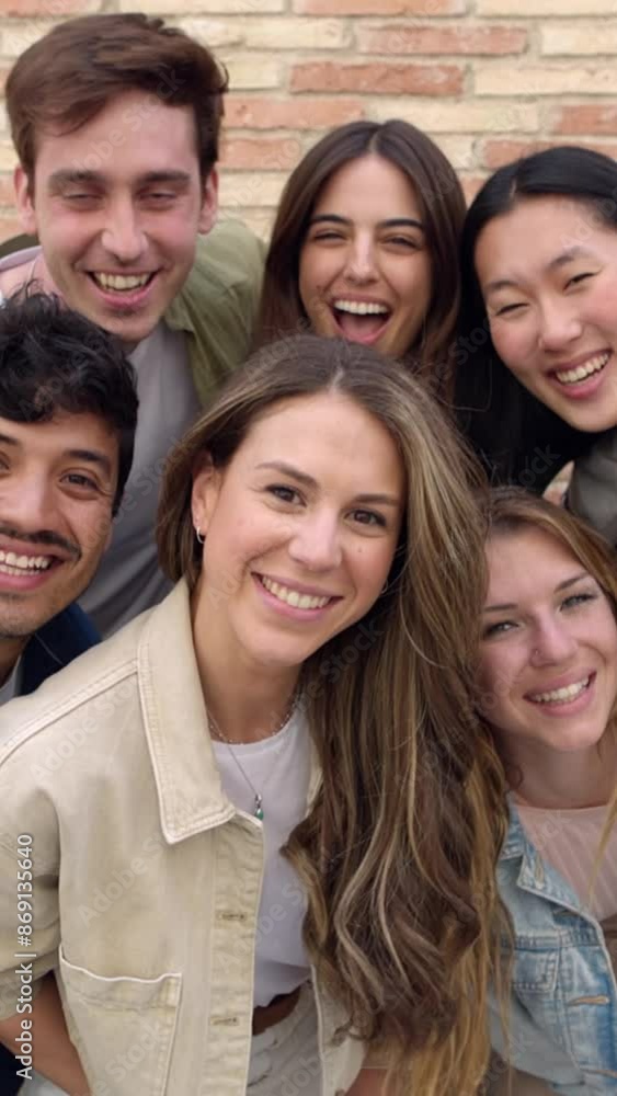 Vertical video. Happy group of young friends smiling at camera outdoors. Portrait of multiracial student people having fun together. Friendship concept. Vertical video. Happy group of young friends smiling at camera outdoors. Portrait of multiracial student people having fun together. Friendship concept.