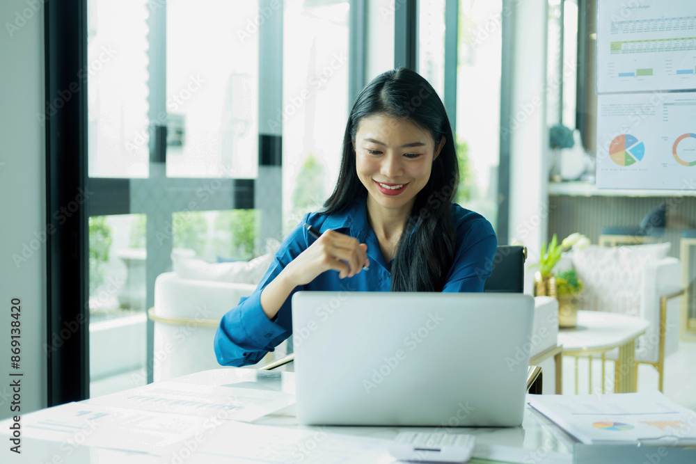 Woman is working on laptop.