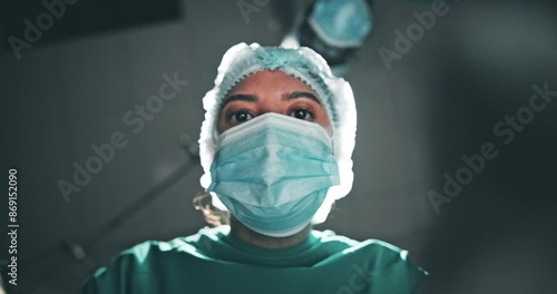 Patient, pov and surgeon in team in hospital with tools, check or help in emergency room with low angle. Doctors, surgery and people in collaboration with ppe for safety, hygiene or service at clinic photo