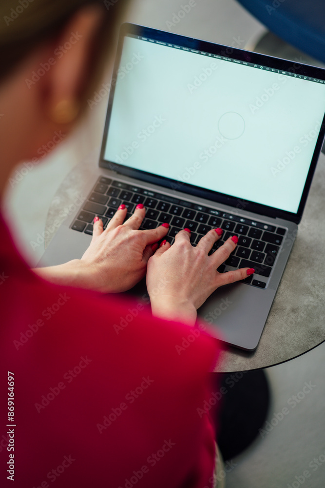 Businesswoman typing on laptop working at office Businesswoman typing on laptop working at office