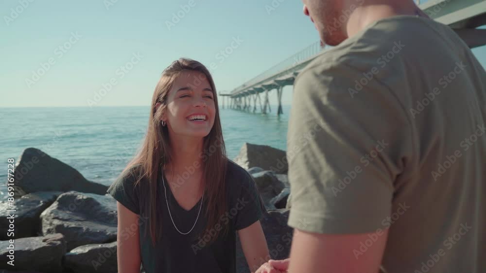 Romantic couple talking on the beach holding hands Romantic couple talking on the beach holding hands