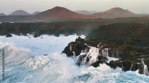 Beautiful texture of big power dark ocean waves with white wash. Aerial top view footage of fabulous sea tide on a stormy day. Drone filming breaking surf with foam in Atlantic ocean.