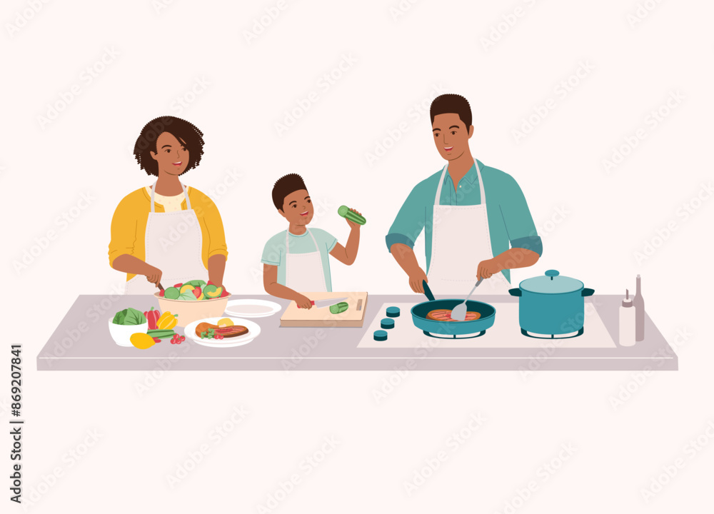 Black Family Preparing Food Together In The Kitchen. Smiling Little Son In Apron Cutting Cucumber With Knife. Father Cooking Steak With Frying Pan. Mother Making Salad. Black Family Preparing Food Together In The Kitchen. Smiling Little Son In Apron Cutting Cucumber With Knife. Father Cooking Steak With Frying Pan. Mother Making Salad.