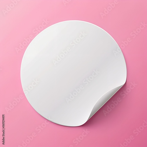 A realistic, round, white paper adhesive sticker mock-up on pink background