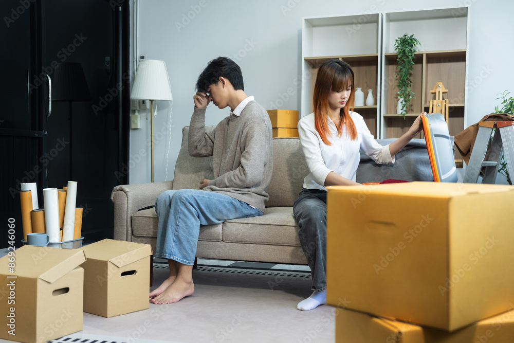 Unhappy young couple sitting apart, having problems in relationship, thinking of breaking up or divorce, upset, family lovers, man and woman avoid talking in relationship problems. Unhappy young couple sitting apart, having problems in relationship, thinking of breaking up or divorce, upset, family lovers, man and woman avoid talking in relationship problems.