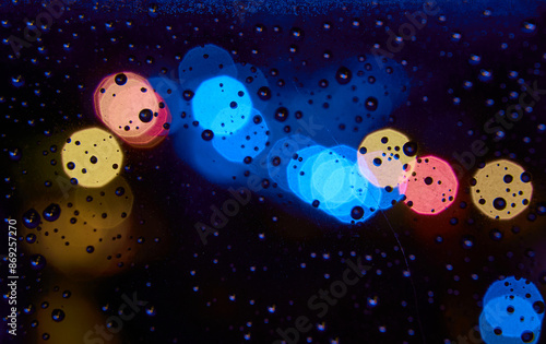 Water drops on a window with beautiful colors