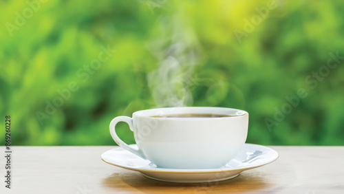 coffee cup in around coffee beans on Wooden tabletop with blurred tea plantation landscape against blue sky and blurred green leaf frame Product display concept natural background