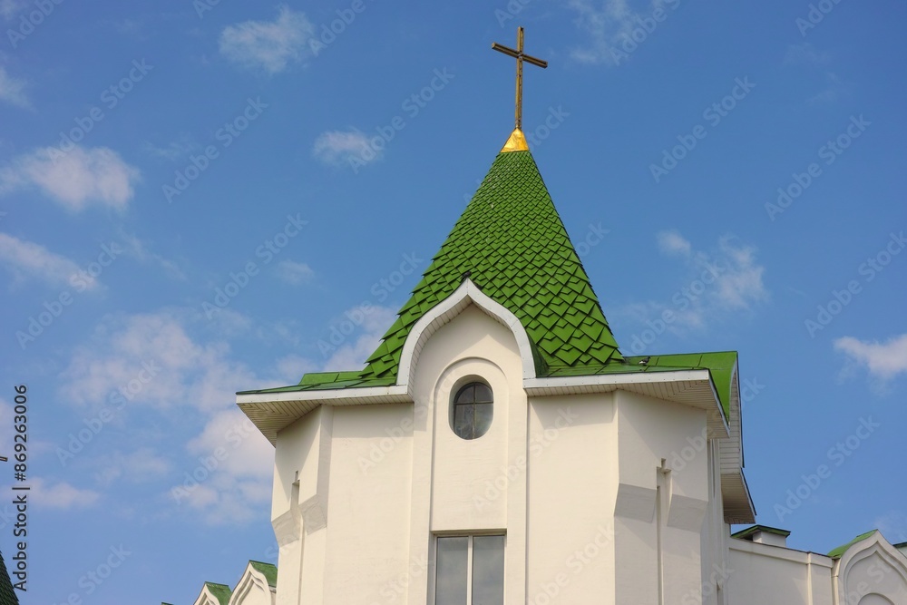 Green dome of Christian Church against blue sky Green dome of Christian Church against blue sky