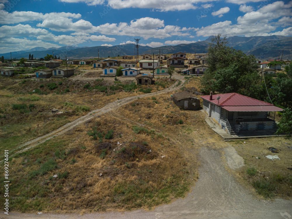 Fototapeta premium One-storey earthen houses by the lake