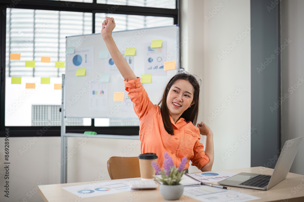 Young Businesswoman Working Relaxed in Modern Office with Charts and Sticky Notes on Whiteboard Young Businesswoman Working Relaxed in Modern Office with Charts and Sticky Notes on Whiteboard