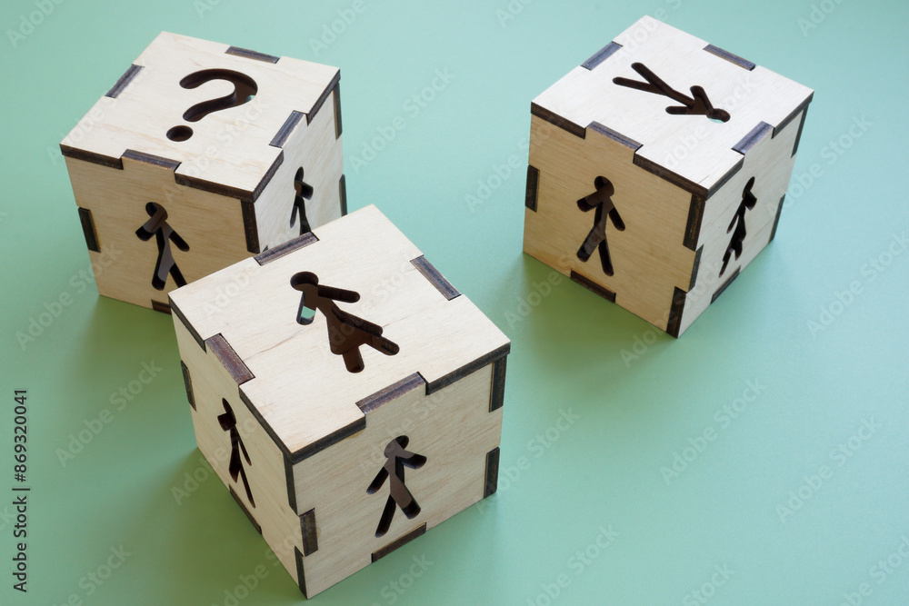 Cubes with figures of a woman, a man and question mark. Gender equality in employment and career. Cubes with figures of a woman, a man and question mark. Gender equality in employment and career.