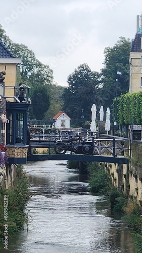 motorcycle on a bridge over a canal