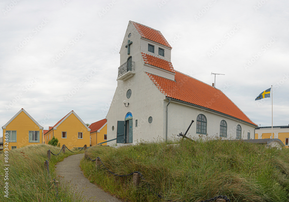 the paved path up to the entrance of the Swedish Church in Skagen the paved path up to the entrance of the Swedish Church in Skagen