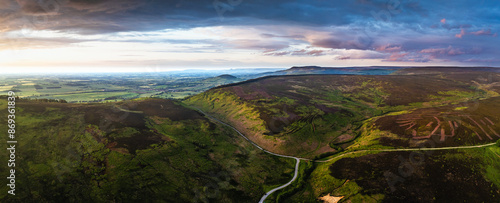 Panorama of Sunset over Cod Beck Reservoir from a drone, North York Moors National Park, North Yorkshire, England