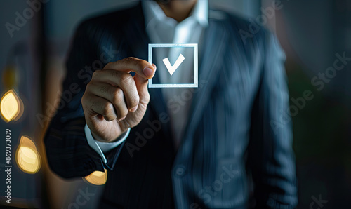 Businessman showing check mark for quality assurance and guarantee approval