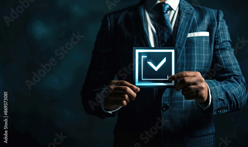 Businessman holding check mark symbol for complete mission objective