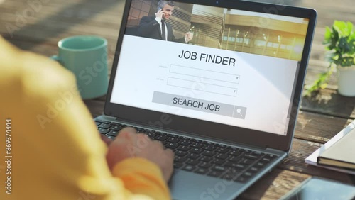 searching job at the computer using online application,back view of male at the laptop looking for occupation,vacancy on internet search engine work app