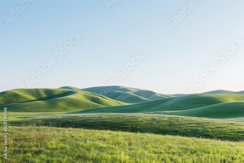 A peaceful landscape with gently rolling hills and a serene blue sky.