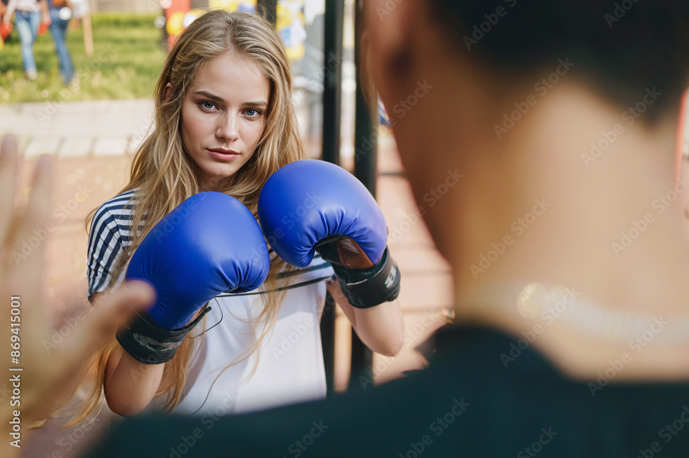 portrait of a young woman with boxing gloves portrait of a young woman with boxing gloves