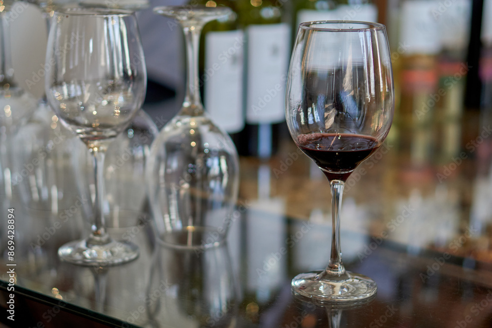 several glasses of wine on a glass table in a wine cellar at a wine tasting. Selective focus several glasses of wine on a glass table in a wine cellar at a wine tasting. Selective focus