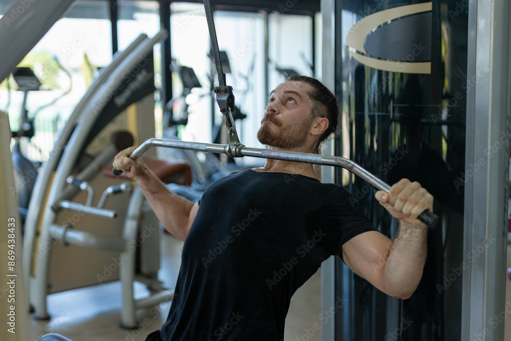 Man workout on pressing machine in gym calories burn lose weight for health. Strong sportsman exercising chest press machine in gym. Exercise to increase arm and shoulder muscles. Man workout on pressing machine in gym calories burn lose weight for health. Strong sportsman exercising chest press machine in gym. Exercise to increase arm and shoulder muscles.