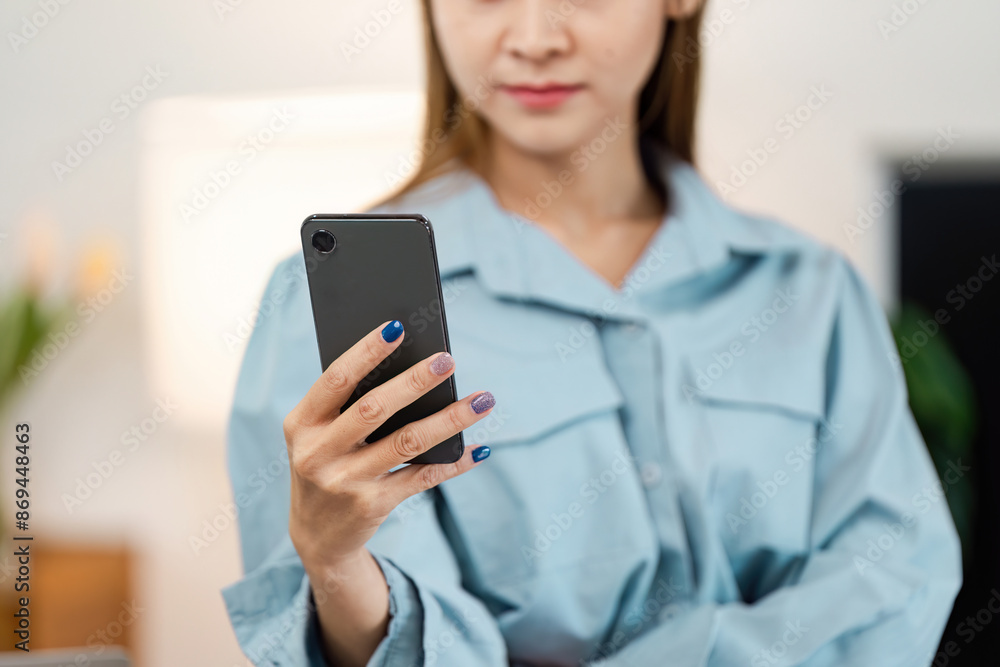 Professional Woman Working from Home Using Smartphone for Remote Business Communication Professional Woman Working from Home Using Smartphone for Remote Business Communication