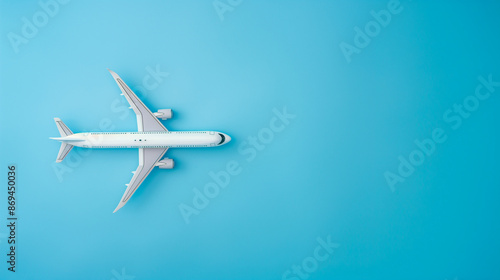 Airplane on blue background, copy space