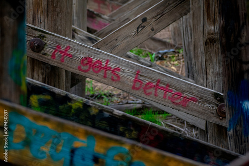 Motivational quote on wood bridge structure supports