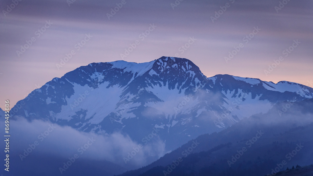 Sunrise towards the Tuc de Barlonguèra summit on a foggy spring morning (Aran Valley, Catalonia, Pyrenees, Spain) Sunrise towards the Tuc de Barlonguèra summit on a foggy spring morning (Aran Valley, Catalonia, Pyrenees, Spain)