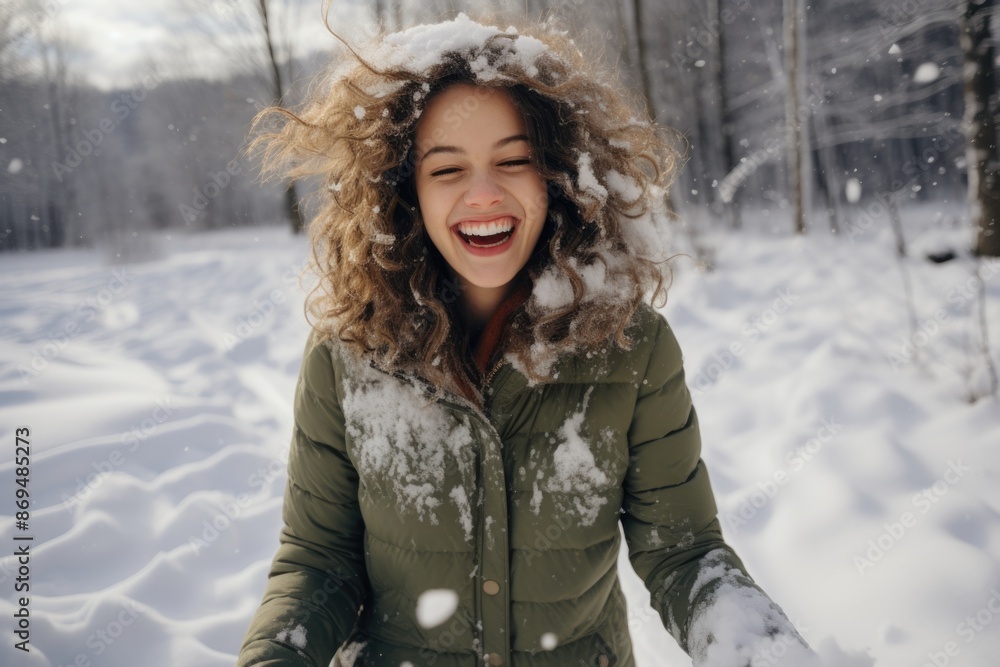 Adorable smile teenage girl playing in the snow in a pine forest. Children winter activities Adorable smile teenage girl playing in the snow in a pine forest. Children winter activities