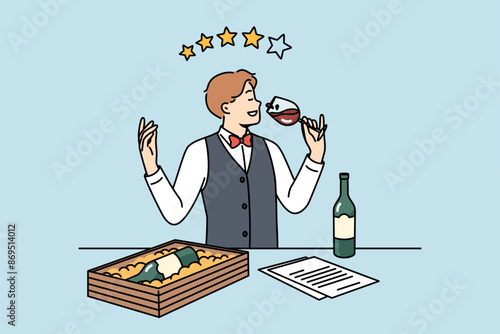 Man sommelier drinks wine from glass and gives rating out of 4 stars for drink with less than ideal taste. Sommelier tastes premium alcohol to choose best bordeaux for restaurant menu