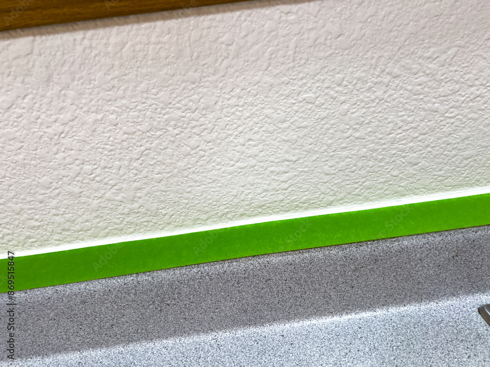 Fototapeta premium Close-Up of Masking Tape and Countertop Edge During Home Renovation