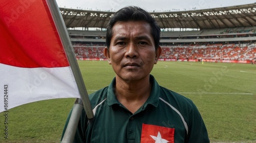 Photo spectator with indonesian flag at soccer stadium