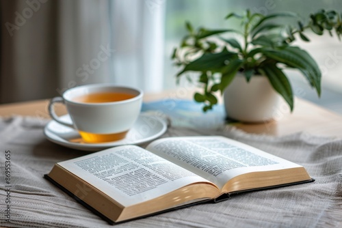 A reading scene with an open book and a cup of tea on a simple background. The minimal setup highlights the tranquility of reading.